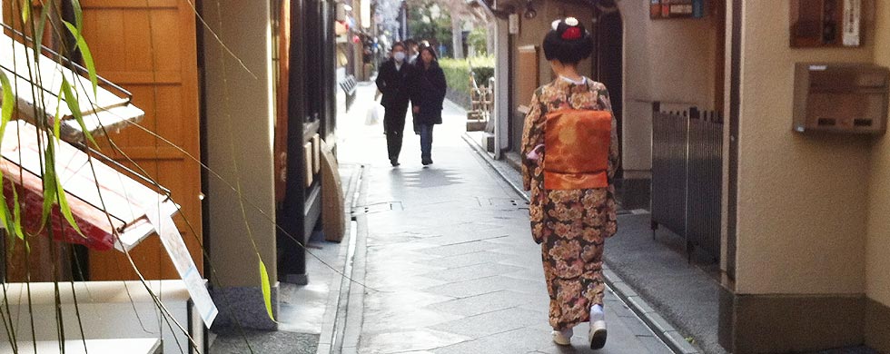 Geisha walking in the streets of Kyoto.